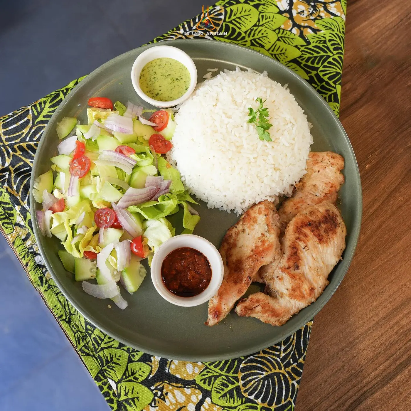 Fried chicken with rice, salad and two sauces