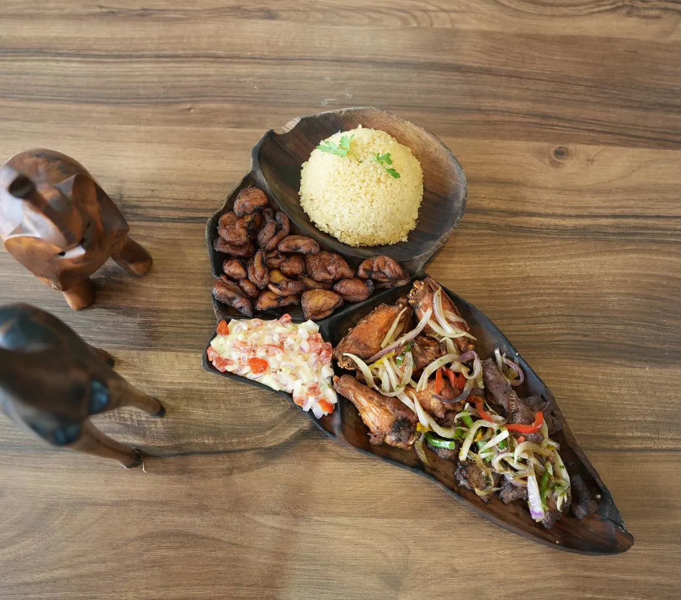 A grill board of marinated cuts served on dark wood